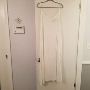 White slip dress with pockets.